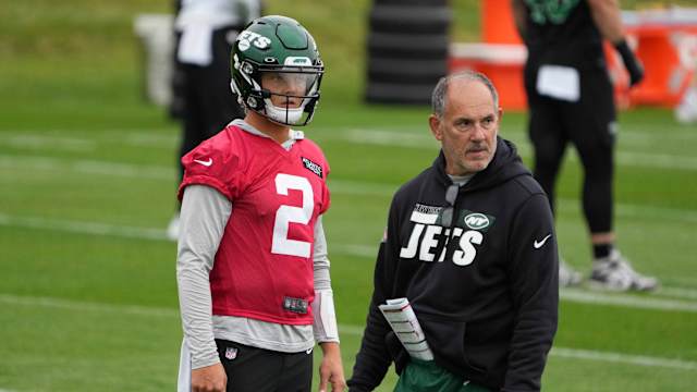 New York Jets quarterback Zach Wilson (2) and offensive line coach John Benton during a practice.